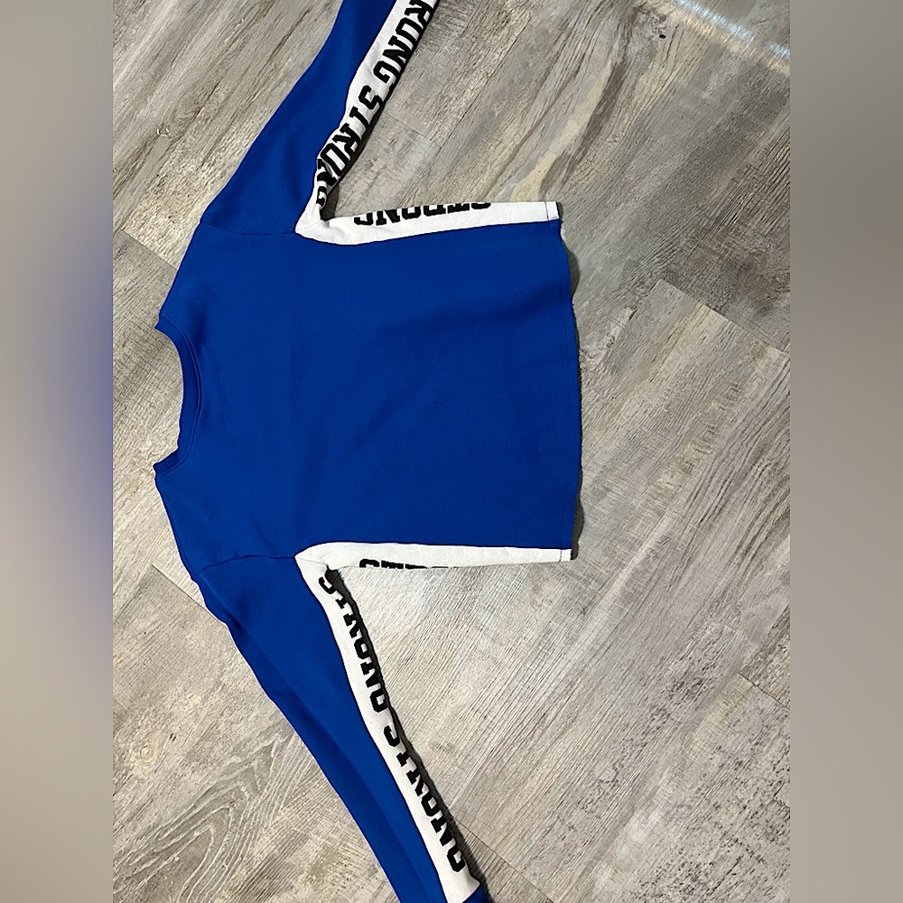 A cute cozy Justice hoodie!! The words along sleeve say “strong”🫶💙